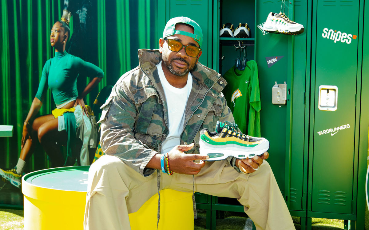 HBCU Student holding Snipes Sneaker