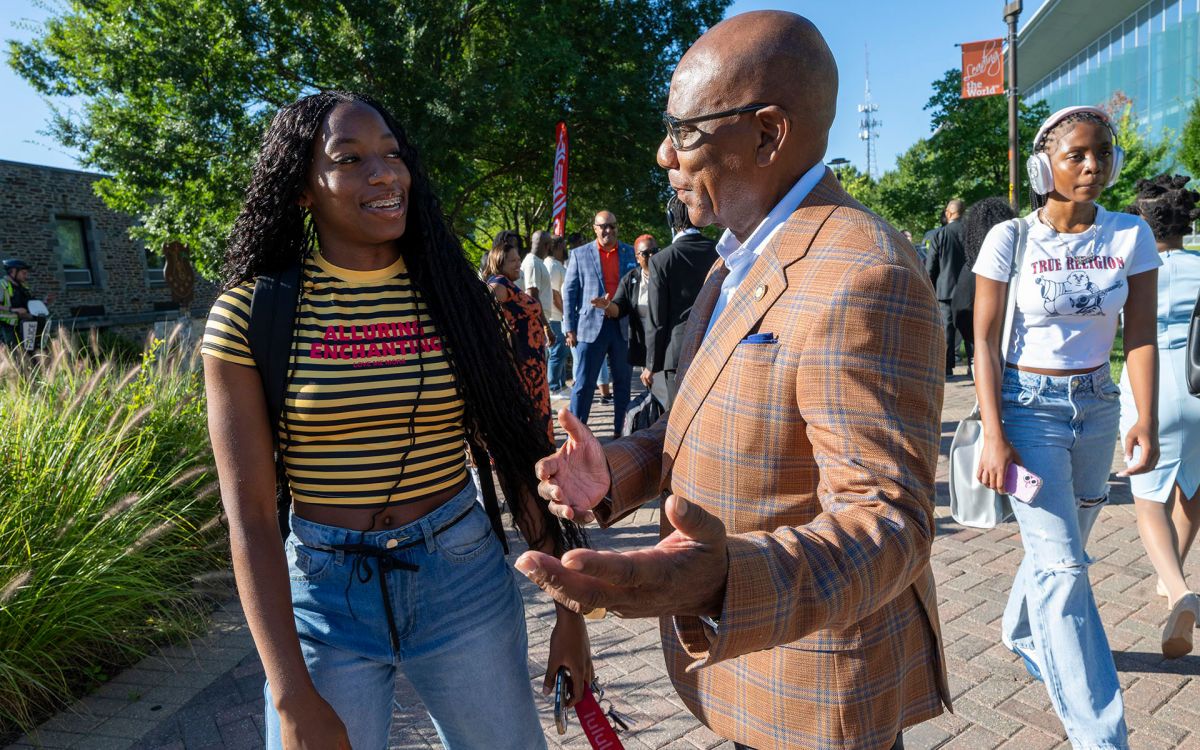 Morgan State received 63 Million from MacKenzie Scott, picture Morgan President Wilson on campus with a Student